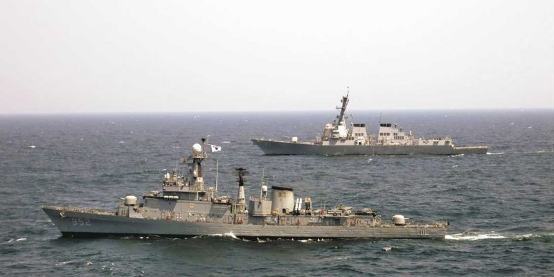 In the Pacific this April, the US Navy guided-missile destroyer USS McCampbell, furthest from camera, underway alongside the Republic of Korea Ulsan Class frigate ROKS Seoul during a passing exercise. The American warship recently intercepted a suspect North Korean vessel. Photo: US Navy.